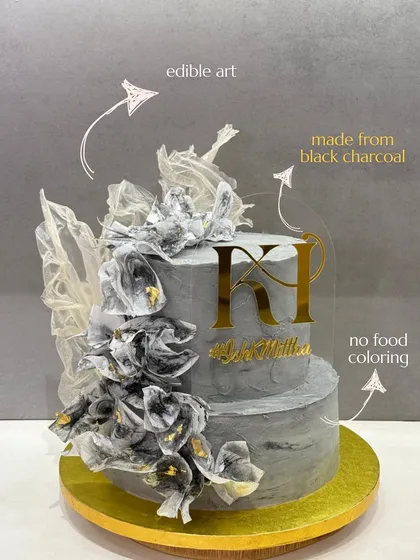 I believe a cake should be both beautiful and pure. This two-tiered edible art piece gets its unique grey hue from natural black charcoal, not artificial food coloring, proving that indulgence never has to compromise on quality.