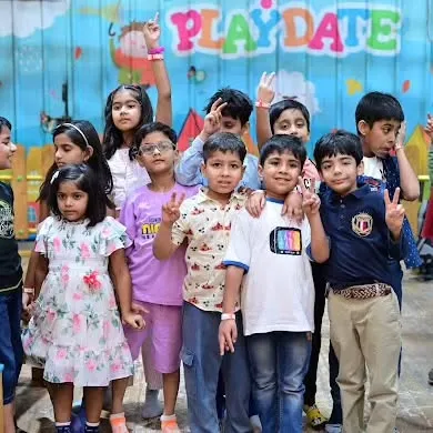 A group of friends posing for a fun photo. Our parties are a great place for kids to socialize and have a great time together.