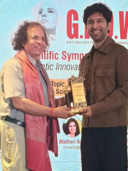 Receiving an award at the GROW symposium. It is always a pleasure to be recognized for my contributions to scientific discussions that promote precision and safety in aesthetics.