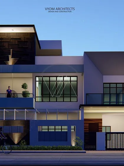 The facade of the Arun Reddy residence in Hosur, designed on a corner plot. The concept plays with solid and void masses, using angular inclined walls to create a unique, contemporary look that is also fully Vastu-compliant.