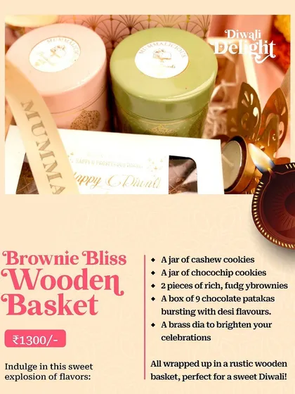 Our "Brownie Bliss Wooden Basket" for Diwali, a rustic basket filled with cookies, brownies, chocolate patakas, and a diya.