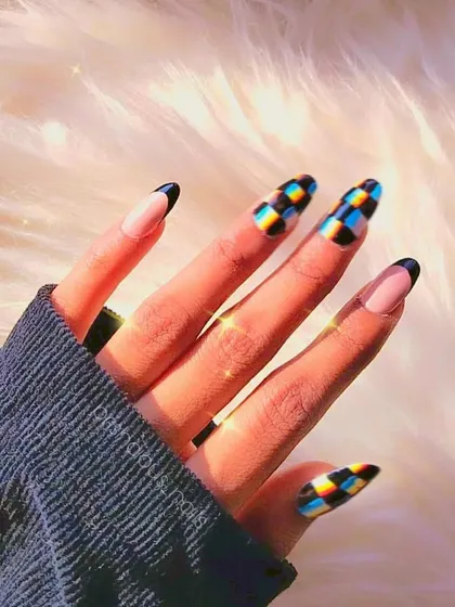 Trippy! A cool checkerboard design with a holographic effect, combined with a classic black French tip.