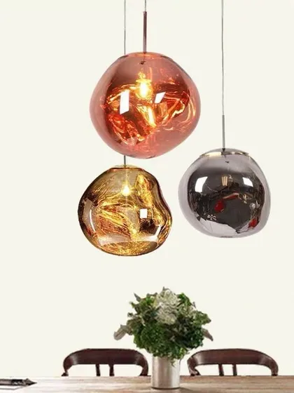 Inspired by molten glass, these designer lava pendants are true conversation starters. Available in different metallic finishes, they can be hung as a single statement piece or in a cluster to create a dramatic lighting installation over a dining table or in a corner.