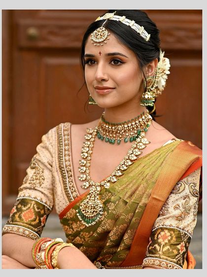 A duplicate image of the cream-colored blouse with exquisite Kalamkari-inspired embroidery on the sleeves, paired with delicate zardosi work along the neckline.