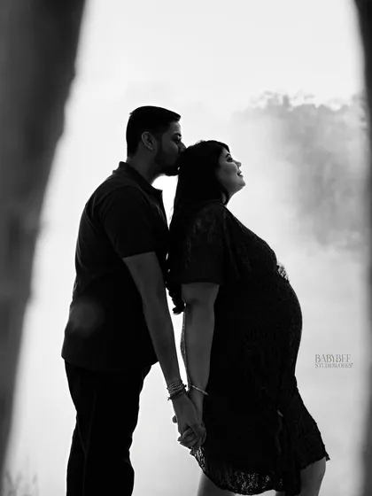 There is so much beauty in simplicity. This black and white silhouette captures a quiet, intimate moment between partners, focusing on your connection and the beautiful shape of your growing family.