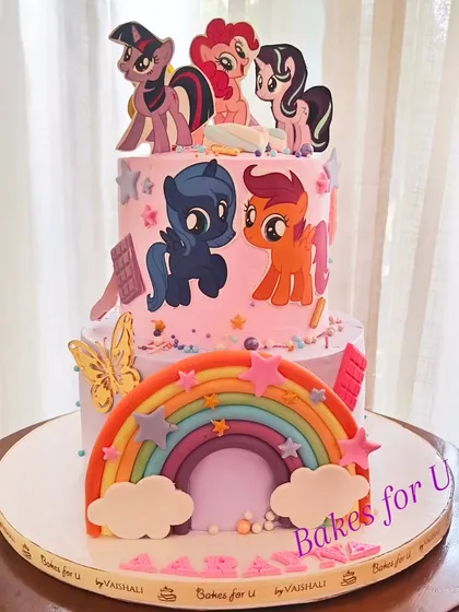 A My Little Pony cake for a fan of the show, featuring a beautiful fondant rainbow and edible images of the beloved pony characters.