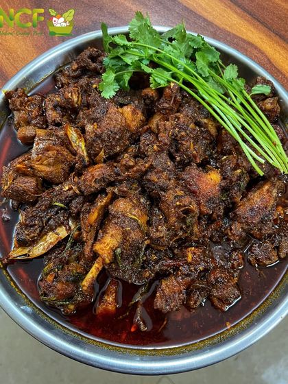 This is Nganu thongba, a traditional Manipuri duck curry. It has a deep, rich flavor from the slow cooking process and aromatic spices.