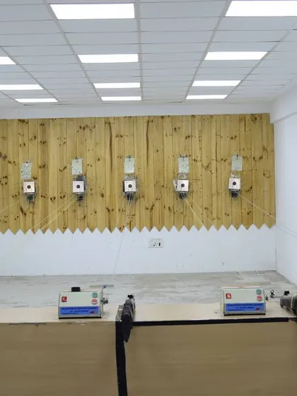 A clear view of one of our indoor shooting ranges. We provide a professional, safe, and well-lit environment equipped with electronic targets, essential for focused and productive training sessions.