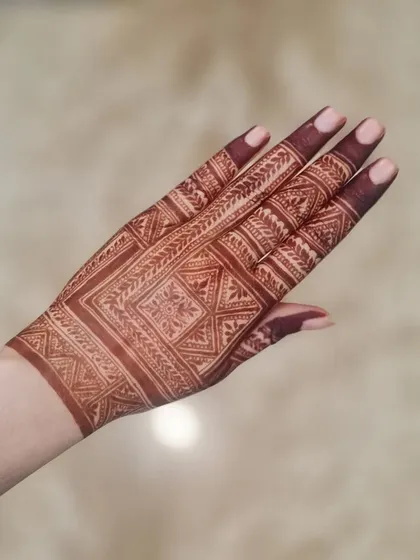 The mature stain of a geometric design inspired by another artist. The deep color really makes the sharp lines pop.