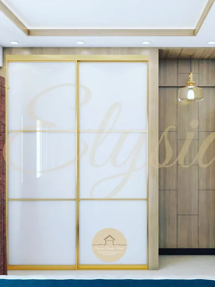 This master bedroom features a sliding wardrobe with a glossy white and gold finish. The design saves space while adding a touch of glamour, perfectly complementing the room's luxurious feel.