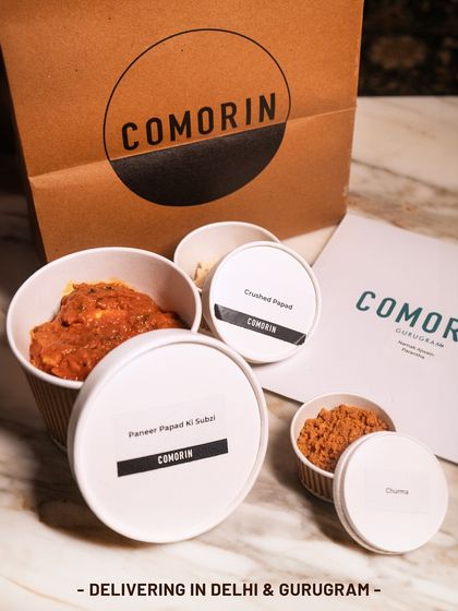 Our Paneer Papad Ki Sabzi, packed with its accompaniments. The creamy paneer curry comes with crushed papad and sweet churma on the side, so you can add the crunch right before eating.