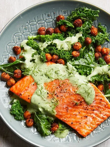 This is what healing food looks like. A perfectly cooked salmon fillet on a bed of fresh kale, topped with a nutritious dill sauce and roasted chickpeas. Our therapeutic meals are designed to be both nourishing and delicious.