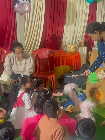 A child interacts with one of the puppets during a jungle-themed show. These moments of connection between the kids and the characters are truly special.