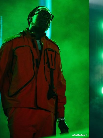 Don Toliver, bathed in dramatic green light, takes the stage at Rolling Loud India. The moody lighting and smoke create a powerful silhouette, showcasing my use of color in concert photography.