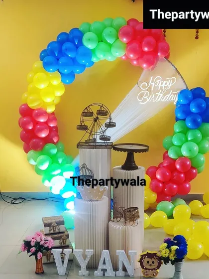 A bright and colorful ring decoration with rainbow-colored balloons. This is a super fun and cheerful option for any happy celebration.