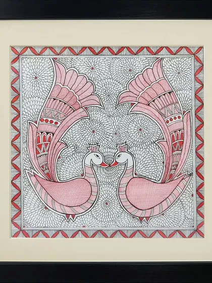 A pair of pink swans touch beaks in this symmetrical Madhubani painting by Rinki Joshi. The background is filled with a dense, fine-lined pattern, creating a beautiful contrast with the simple elegance of the birds.