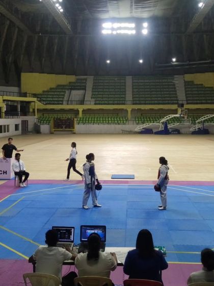 Athletes getting ready for their match in the vast expanse of the Kanteerava Indoor Stadium. The atmosphere of a big competition is a learning experience in itself.