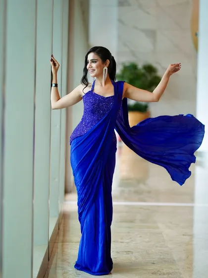 Modern, confident, and full of life. This royal blue saree-gown is for the contemporary woman, and I make sure to model it with the power and movement it deserves. This look is perfect for cocktail events and reception nights.