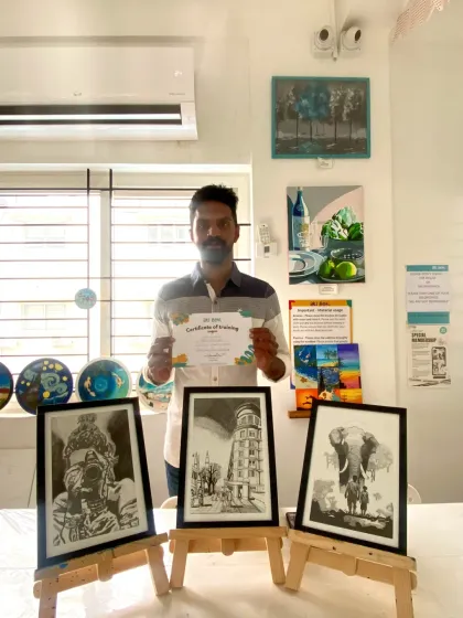 This student's three sketches showcase his ability to capture complex subjects, including an elephant and an urban scene.