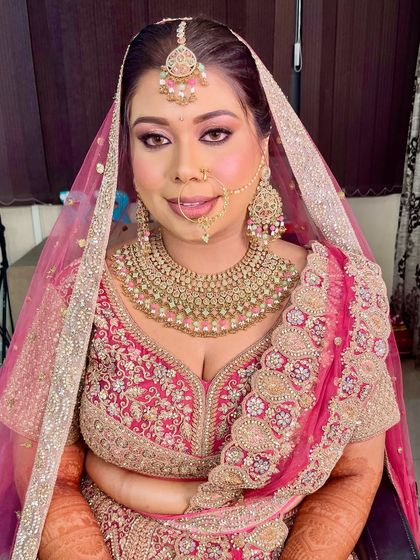 Our beautiful bride is ready for her D-day. The complete look, with a flawless base, sparkling eyes, and perfectly defined lips, ensures she looks and feels her best.