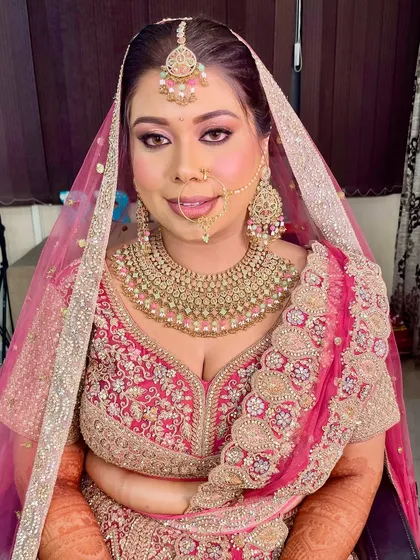 Our beautiful bride is ready for her D-day. The complete look, with a flawless base, sparkling eyes, and perfectly defined lips, ensures she looks and feels her best.