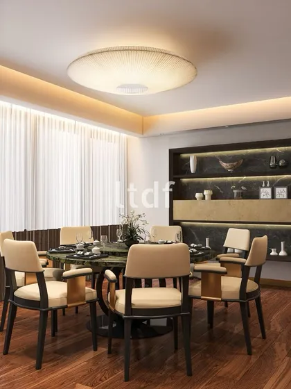 We love a circular dining design for its ability to foster intimate, conversational gatherings. The organic form of the table is complemented by an earthy palette of subtle beige and green, making the dining experience feel warm, inviting, and effortlessly communal.