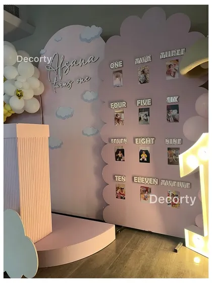 A close-up of the "My First Year" photo display board, a heartwarming detail for any first birthday party.