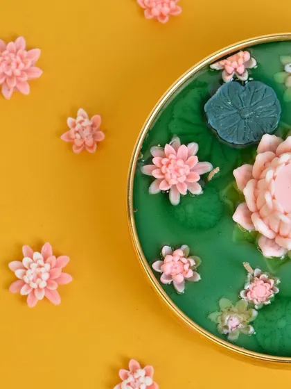 Introducing my Lotus Pond Urli candle. Featuring a central lotus and floating water lilies, this gel wax candle brings a sense of tranquility and elegance to your home.