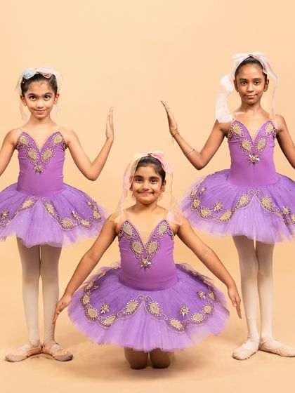 Our little ballerinas posing for their performance of 'Coppélia Reimagined.' Their doll like elegance and static poses are central to this whimsical and charming ballet piece.
