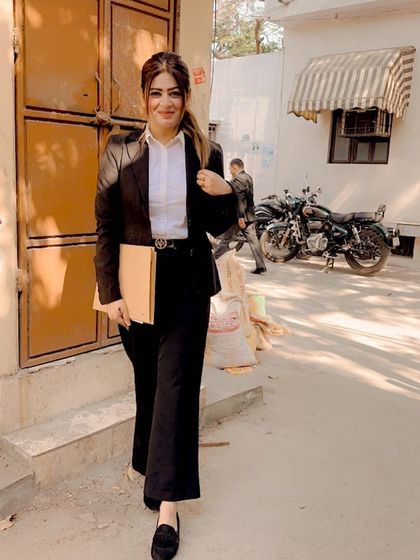 This profession is demanding, but it fills me with energy. A candid moment after a day's work at Tis Hazari court, ready for the next challenge.