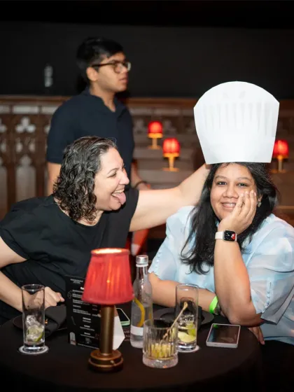 Pure fun at our Ratatouille screening. A guest playfully wears a chef's hat, embracing the whimsical and joyous spirit of the film and our event. We love it when our guests become part of the show.
