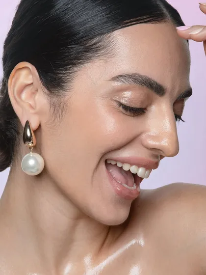 This laughing shot shows how well the makeup wears, without creasing or settling into lines. The focus is on a radiant, happy glow, perfect for lifestyle and beauty campaigns.