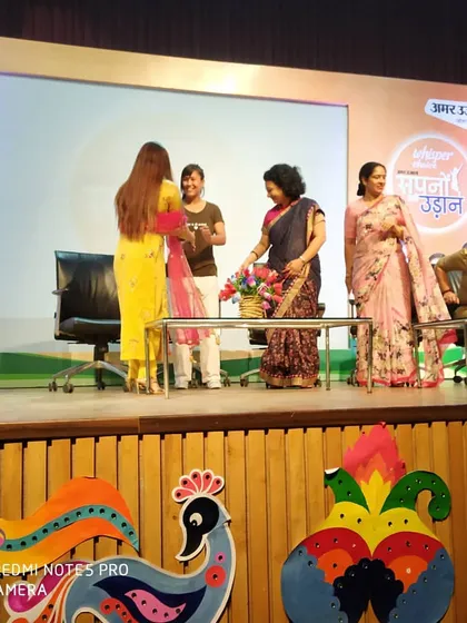 Being recognized on stage at the 'Amar Ujala - Sapno Ki Udaan' event. It is an honor to contribute to a cause that helps women achieve their dreams.