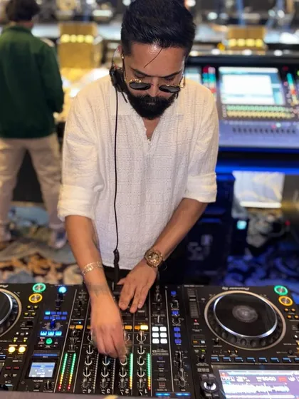 A closer look at my hands on the Pioneer console. Every adjustment to the EQ and effects is deliberate, all to shape the sound and guide the energy of the dance floor.