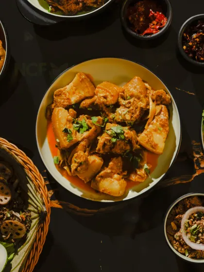 A bowl of my tender pork curry, cooked with potatoes in a rich, flavorful gravy. It's a simple, delicious dish that reminds me of home.