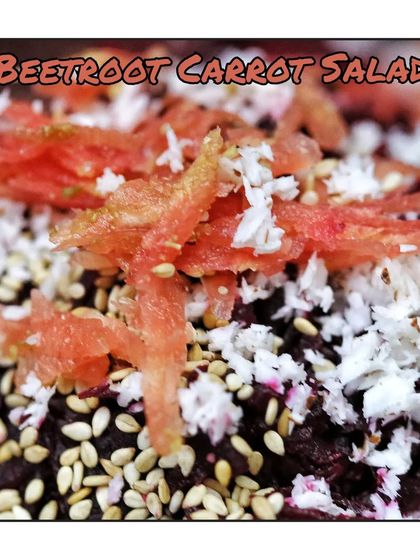 A healthy salad made from grated beetroot and carrot, mixed with fresh coconut, sesame seeds, and a squeeze of lemon.