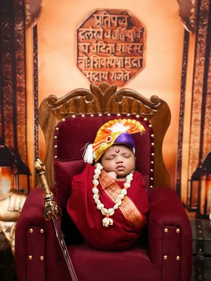 जय भवानी, जय शिवाजी! Seeing a newborn as Chhatrapati Shivaji Maharaj is a moment of immense pride. This setup is complete with a throne, a miniature sword, and the royal seal, capturing the spirit of our great Maratha king for the newest generation.