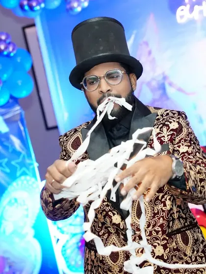 The look of surprise during my paper-from-mouth illusion. It's a classic of comedy magic for a reason, and a highlight of my family entertainment package.