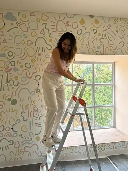 There's nothing more joyful than creating art for kids. For this school's storytelling room, I filled the walls with whimsical, free-hand doodles of animals and suns, turning it into a space that sparks imagination and feels like a warm hug.