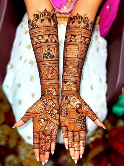 This design is full of blessings, with a Ganesha portrait, Om symbol, kalash, and other auspicious motifs.