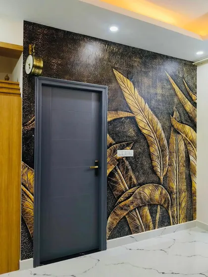 I love creating designs that have depth and texture. This 3D-effect wallpaper with golden leaves adds a touch of luxury and drama to this entryway, making a bold statement right from the entrance.