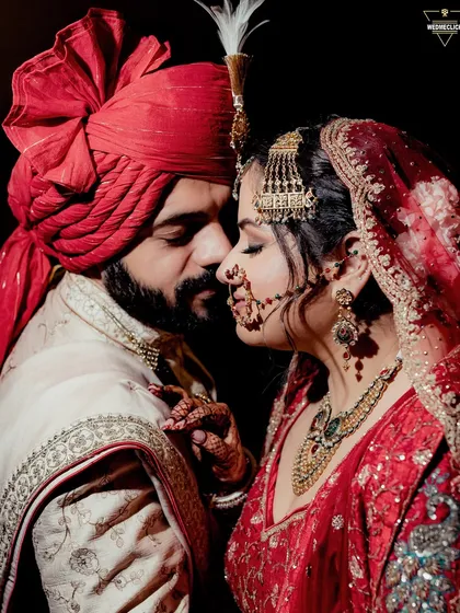 A close-up portrait filled with emotion, capturing the bride's touch and the groom's loving gaze. These quiet, in-between moments are just as important as the grand rituals.