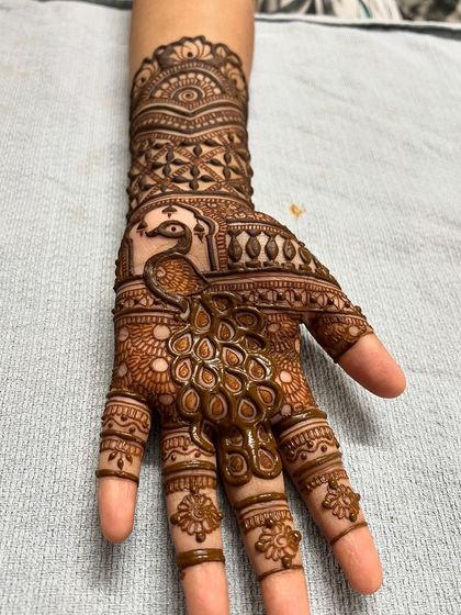 A close-up of the peacock motif from the Vatsavitri festival design.