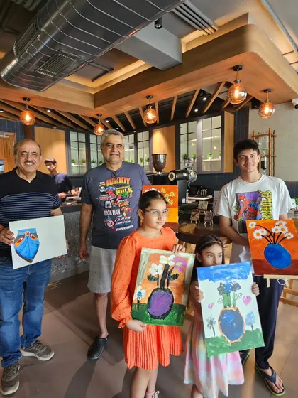 A beautiful family enjoying quality time together at a weekend art workshop. It is wonderful to see different generations bonding over a shared creative activity.