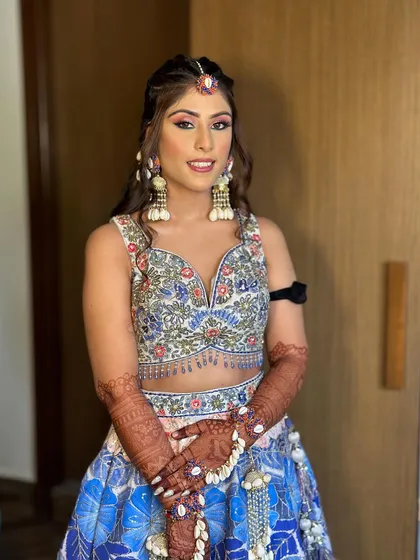 Carnival vibes for bride Ashmeet! This fun and colorful look was created for a daytime event, featuring bright eyes and a fresh, dewy base.