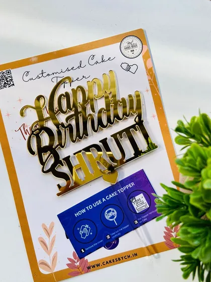 The "Happy Birthday Shruti" topper packaged and ready to go, complete with instructions for use.