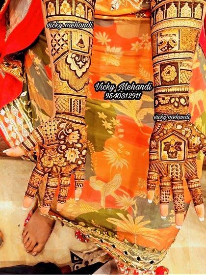 A beautiful example of my team's work, this design combines floral palms with arms that feature geometric patterns and traditional symbols.