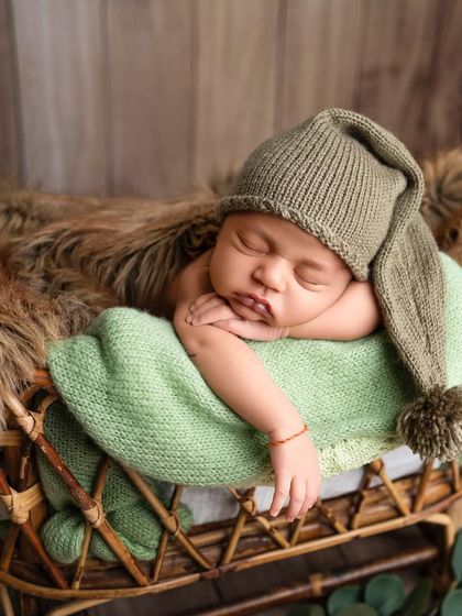 To the most gorgeous little boy. I love using earthy tones like green, which complement a rustic wooden backdrop and bring a natural feel to the portrait.