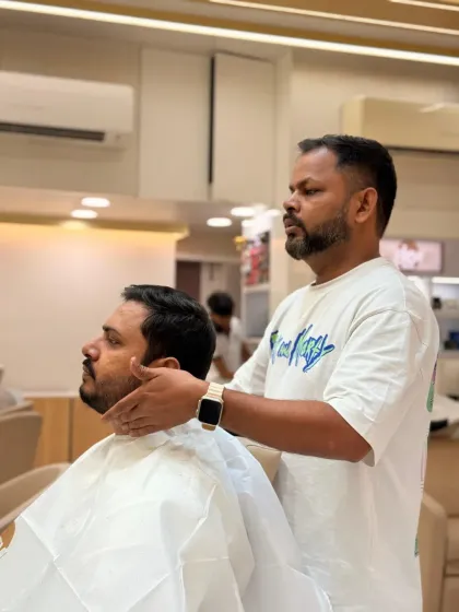 After the trim, our stylist checks the final shape to ensure it's balanced and meets the client's expectations. Your satisfaction is our top priority.