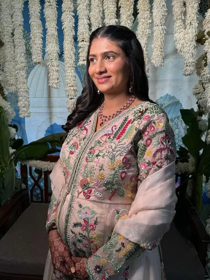 Another lovely shot from her baby shower. She looks so serene and happy, and her skin is absolutely glowing.
